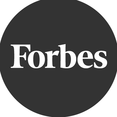 The Forbes logo displayed in white text inside a black circle.